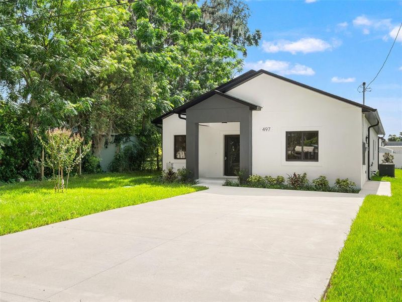 Front exterior of a new home in , Apopka, FL, highlighting curb appeal (Image 2). Front exterior of a new home in , Apopka, FL, highlighting curb appeal (Image 2).