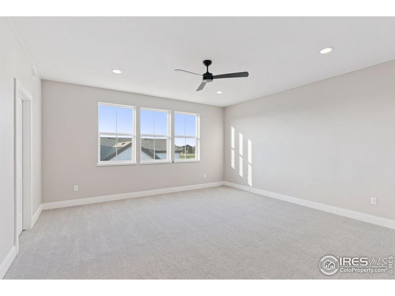 Spacious, unfurnished interior of a new home in Harvest LiteLuxe, Berthoud (Image 20).