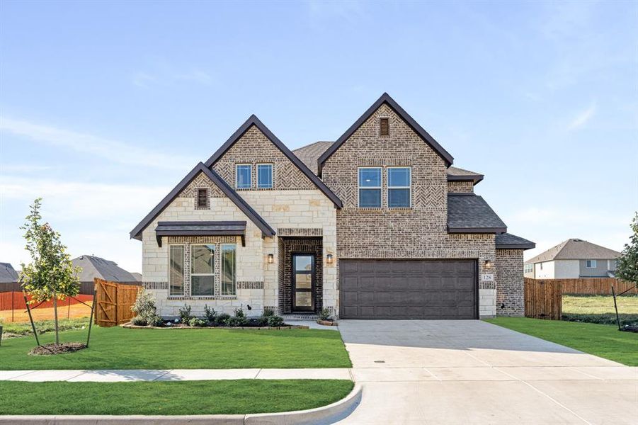 Front exterior of a new home in Hampton Park, Glenn Heights, TX, highlighting curb appeal (Image 21). Front exterior of a new home in Hampton Park, Glenn Heights, TX, highlighting curb appeal (Image 21).