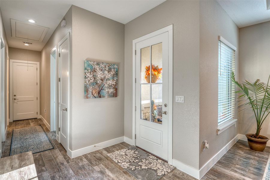 Foyer featuring dark wood-type flooring and recessed lighting