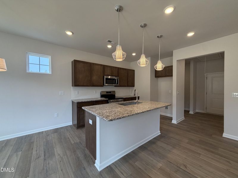 Sleek Granite and Pendant Lighting
