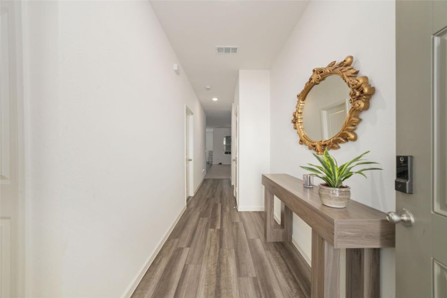 Furnished interior view inside a new home in Sunterra, Katy (Image 15).