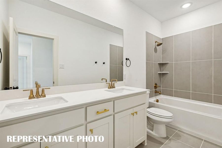 Guests will enjoy their own vanity space in this thoughtfully designed guest bath.  REPRESENTATIVE PHOTO