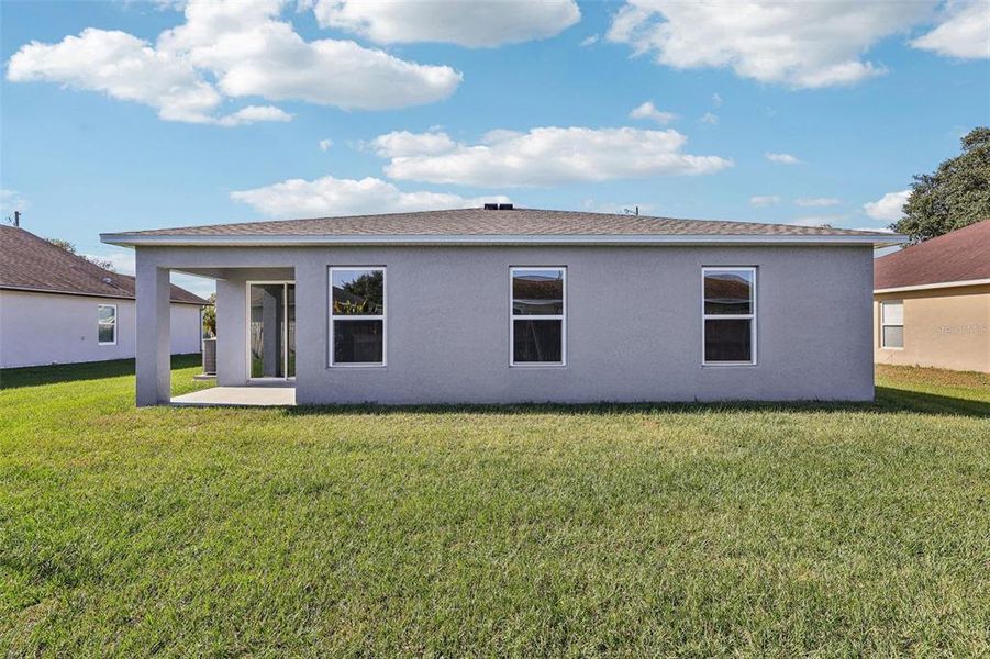 Exterior details and patio area of a home in Stone Ridge, Sebring (Image 12).