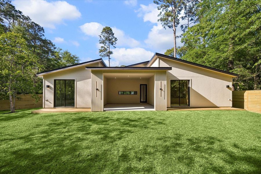 Exterior details and patio area of a home in , Conroe (Image 18).