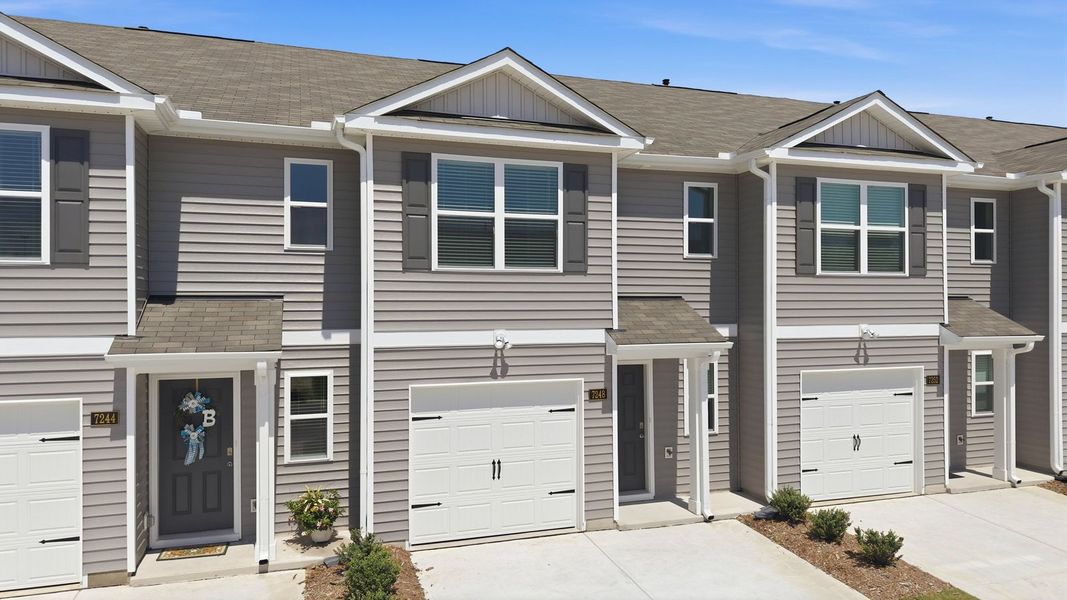 Front exterior of a new home in The Townes at Hunter Hill, Rocky Mount, NC, highlighting curb appeal (Image 17).