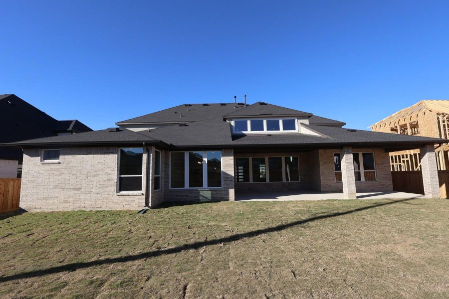 Exterior details and patio area of a home in Dunham Pointe, Cypress (Image 4).