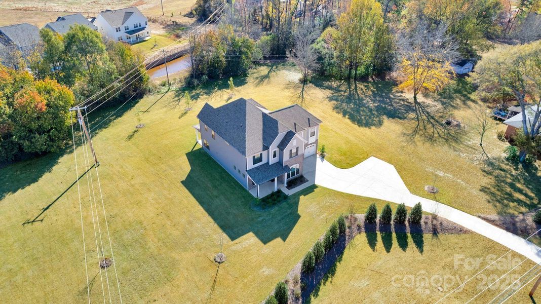 Front exterior of a new home in Whitaker Pointe, Huntersville, NC, highlighting curb appeal (Image 20).