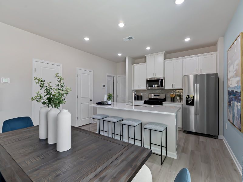 Furnished interior view inside a new home in Cadence Meadows Townes, Zebulon (Image 8). Furnished interior view inside a new home in Cadence Meadows Townes, Zebulon (Image 8).