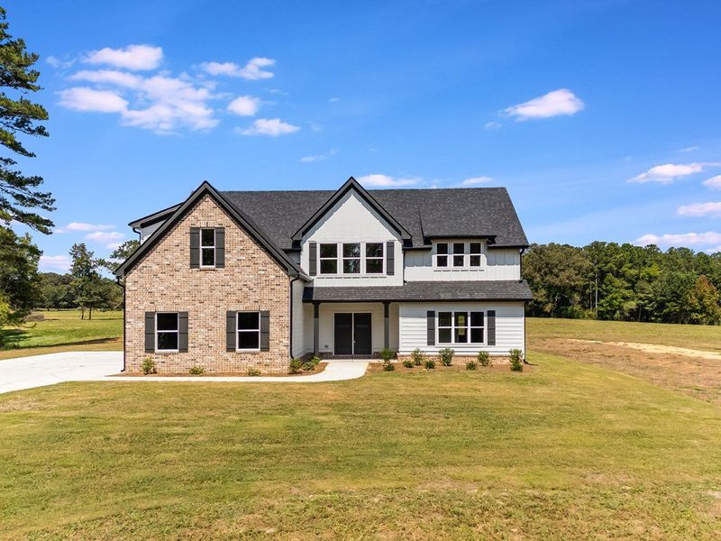 Front exterior of a new home in LOVVORN ESTATES, Carrollton, GA, highlighting curb appeal (Image 24).