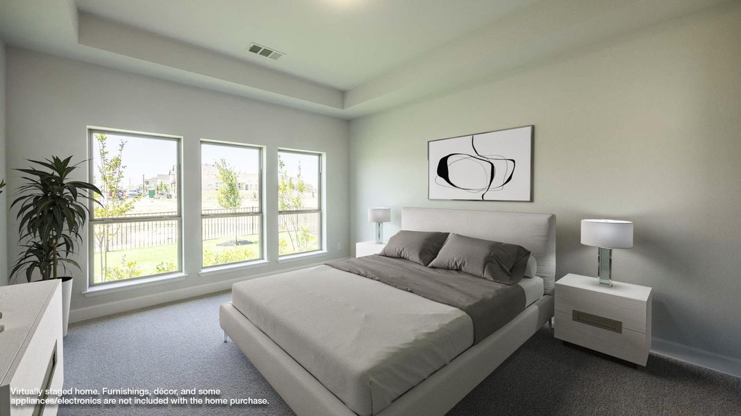 Carpeted bedroom featuring visible vents and baseboards Carpeted bedroom featuring visible vents and baseboards