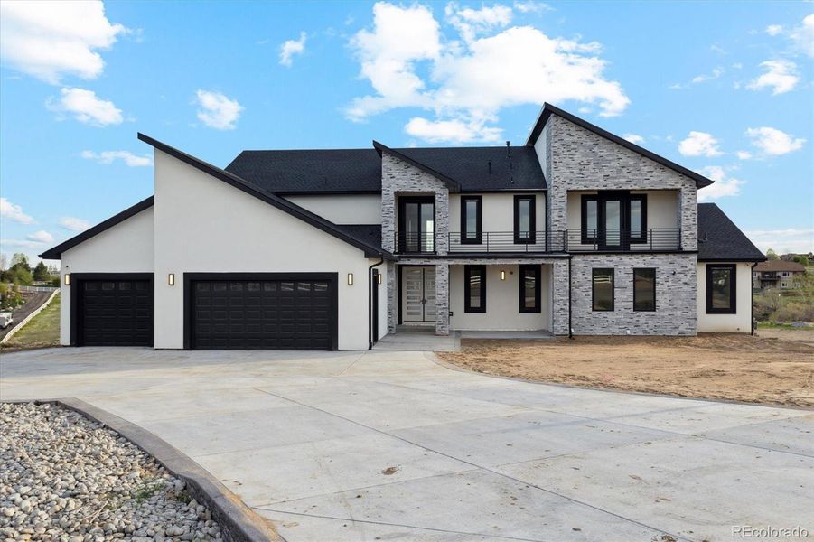 Front exterior of a new home in , Brighton, CO, highlighting curb appeal (Image 24).