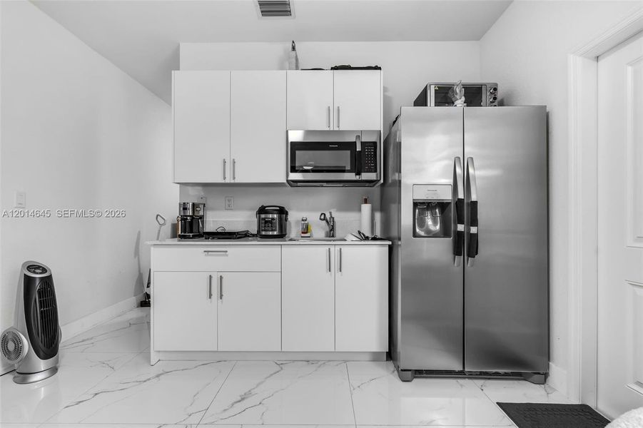 Furnished interior view inside a new home in , Miami (Image 32).