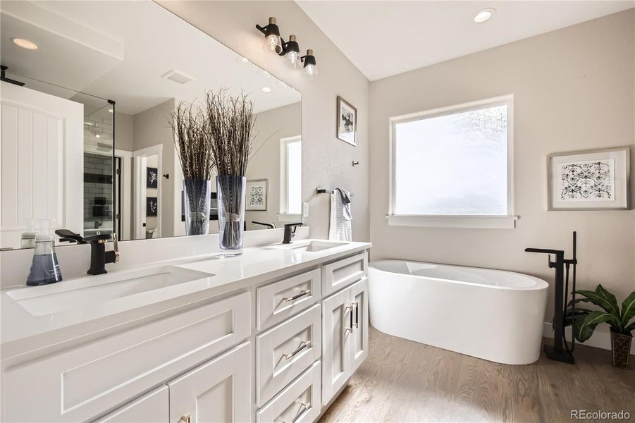 This spa-inspired, 5-piece bathroom is fantastic! It features a large vanity with 2 sinks, and a fabulous soaking tub!