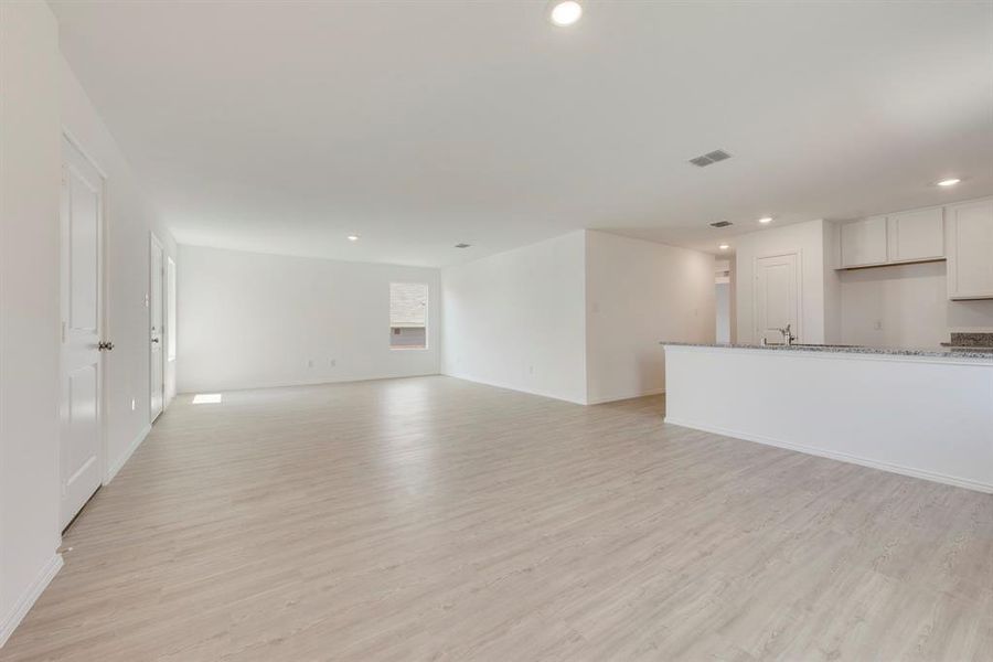 Unfurnished living room with light hardwood / wood-style flooring