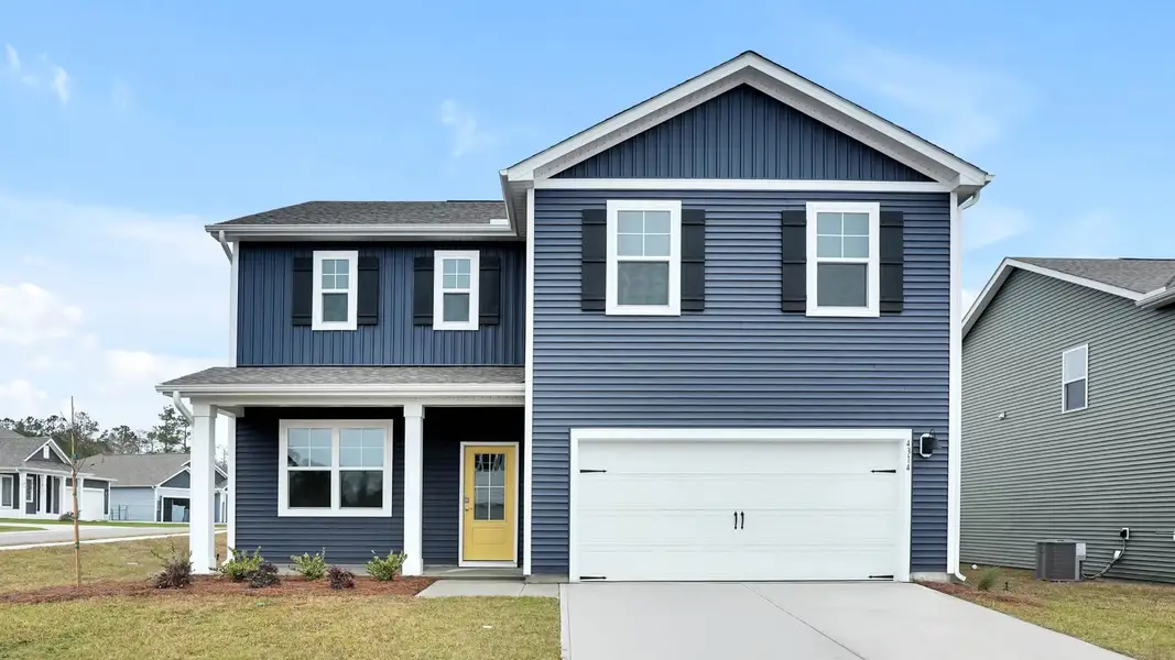Front exterior of a new home in Driftwood, Richlands, NC, highlighting curb appeal (Image 1). Front exterior of a new home in Driftwood, Richlands, NC, highlighting curb appeal (Image 1).
