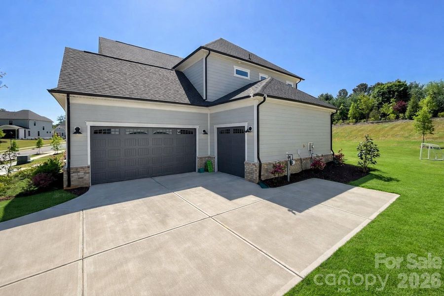 Front exterior of a new home in , Huntersville, NC, highlighting curb appeal (Image 2). Front exterior of a new home in , Huntersville, NC, highlighting curb appeal (Image 2).