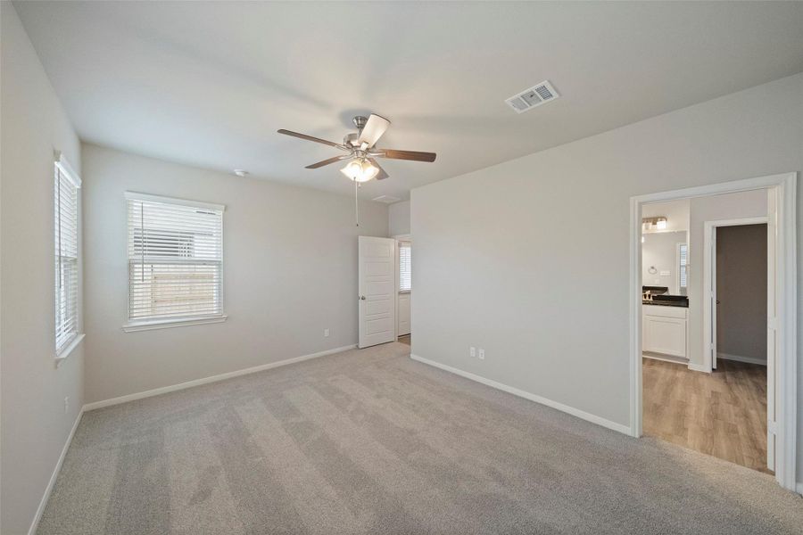 Spacious, unfurnished interior of a new home in Sunterra, Katy (Image 19).