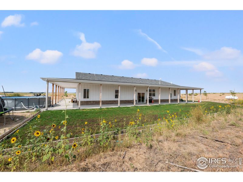Front exterior of a new home in , Weldona, CO, highlighting curb appeal (Image 1).
