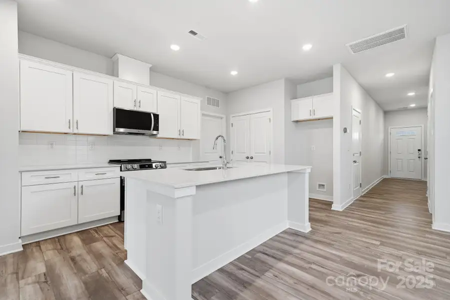 Furnished interior view inside a new home in Meadow Creek Village, Locust (Image 5).