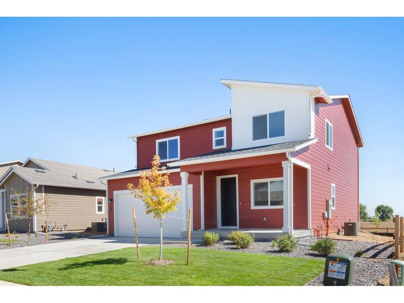 Front exterior of a new home in Granary, Johnstown, CO, highlighting curb appeal (Image 17).