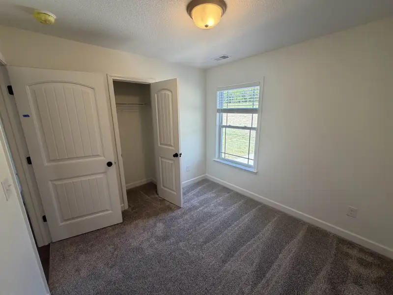 Spacious, unfurnished interior of a new home in Stones Throw, Inman (Image 12).