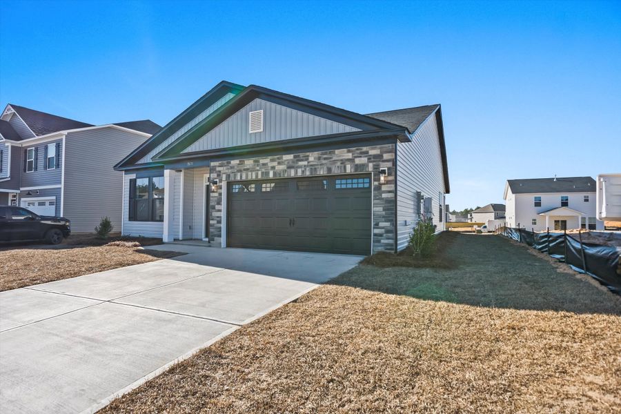 Front exterior of a new home in Portrait Hills, Aiken, SC, highlighting curb appeal (Image 2). Front exterior of a new home in Portrait Hills, Aiken, SC, highlighting curb appeal (Image 2).