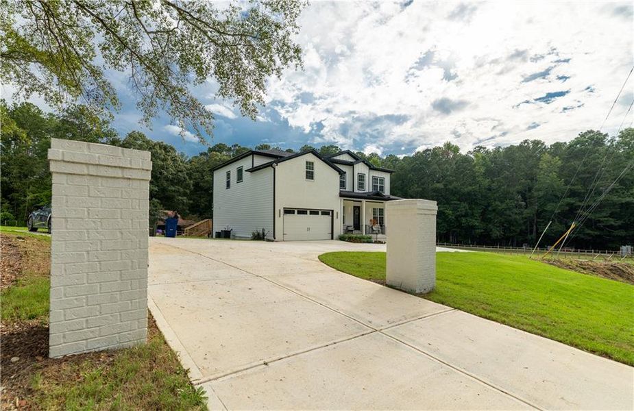 Front exterior of a new home in , Snellville, GA, highlighting curb appeal (Image 23). Front exterior of a new home in , Snellville, GA, highlighting curb appeal (Image 23).