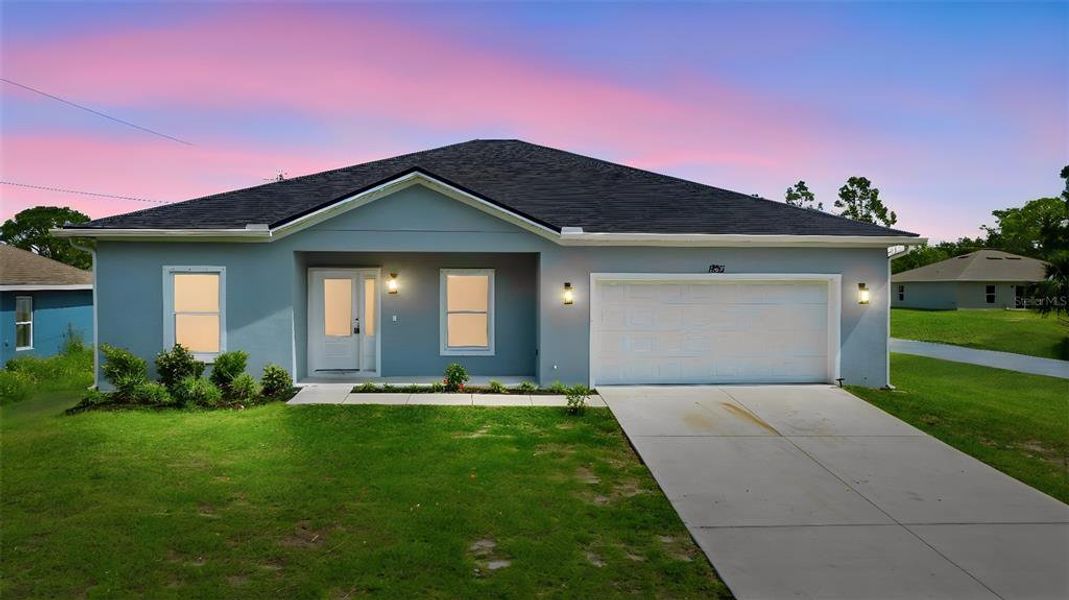 Front exterior of a new home in , Palm Bay, FL, highlighting curb appeal (Image 2). Front exterior of a new home in , Palm Bay, FL, highlighting curb appeal (Image 2).