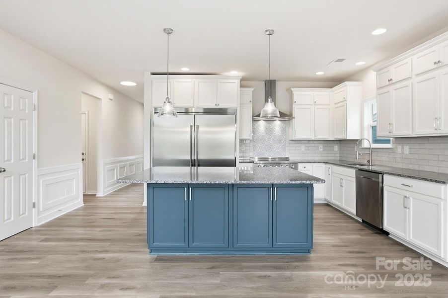 Engage your inner chef in the Gourmet Kitchen, which boasts sleek stainless steel appliances, a center island, granite counters, and a spacious dining area Engage your inner chef in the Gourmet Kitchen, which boasts sleek stainless steel appliances, a center island, granite counters, and a spacious dining area