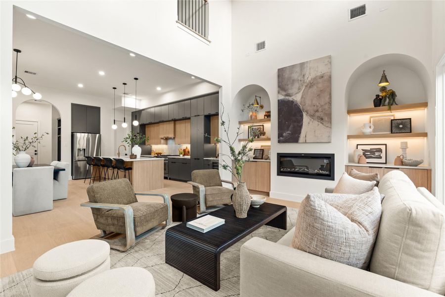 This living room includes a fireplace and two beautifully arched nooks. This living room includes a fireplace and two beautifully arched nooks.
