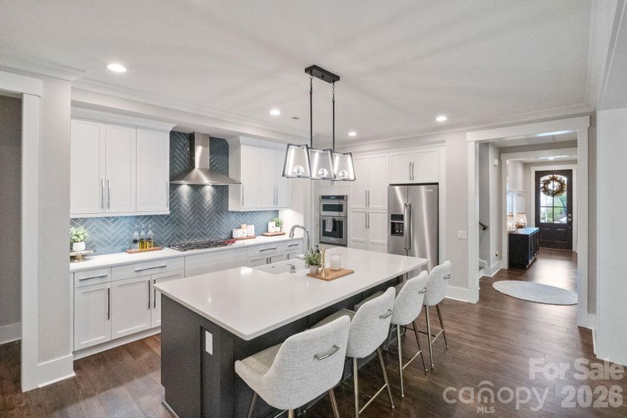 Upgraded kitchen cabinets and chef's appliances- Wolf Range and hood