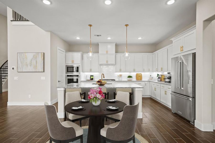 Virtually Staged: The spacious breakfast area is perfect for your morning coffee, and is open to both the kitchen and the living room.