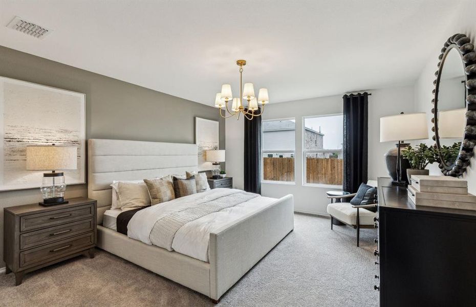 Spacious owner's suite bathed in natural light *Model representation