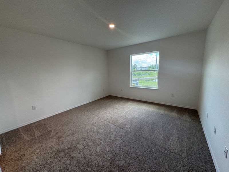 Spacious, unfurnished interior of a new home in Lake Deer Estates, Poinciana (Image 11).