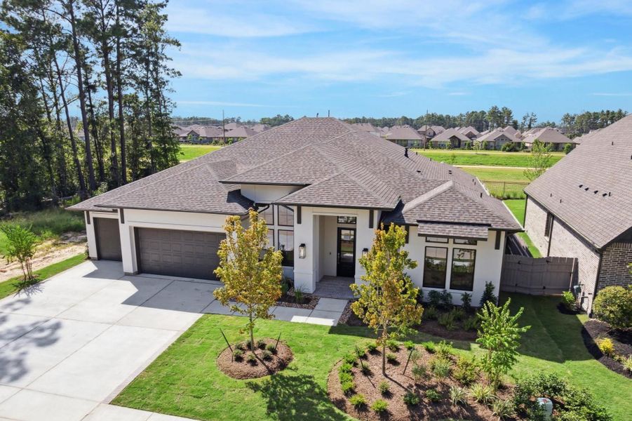 Front exterior of a new home in Artavia, Conroe, TX, highlighting curb appeal (Image 2).