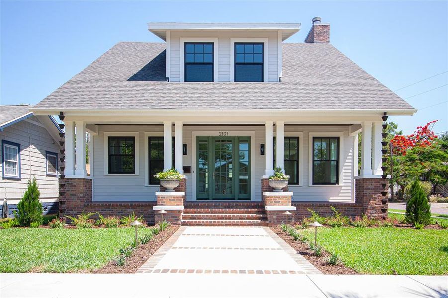 Front exterior of a new home in , St. Petersburg, FL, highlighting curb appeal (Image 22).