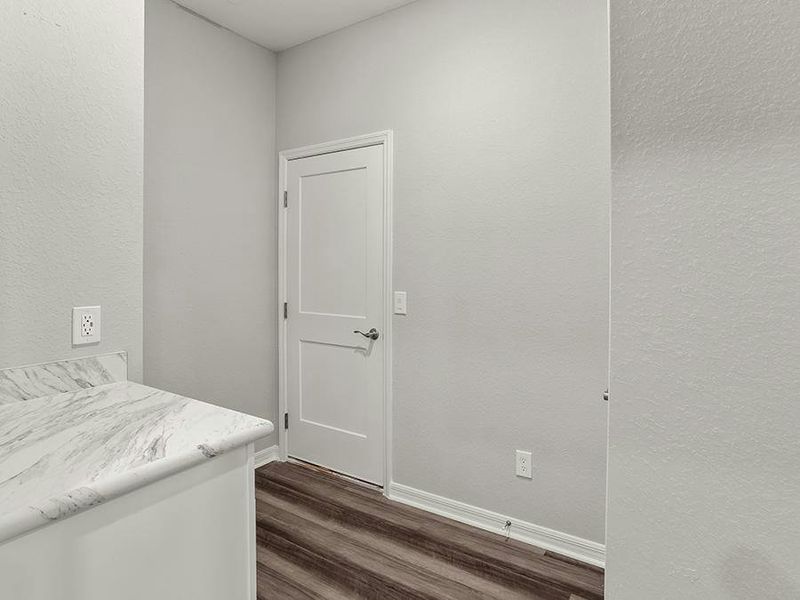 This home also includes a mud room at the garage entry and a separate laundry room.