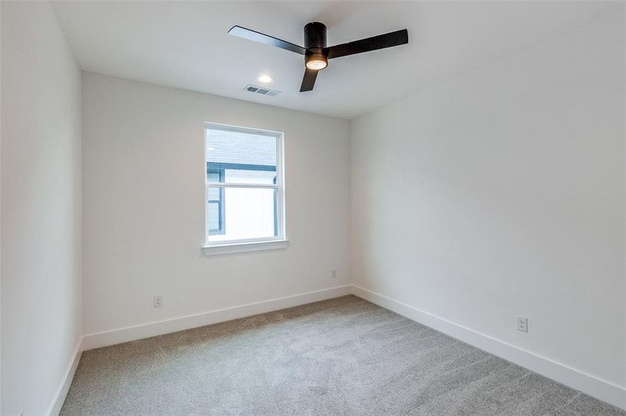 Unfurnished room with carpet floors and ceiling fan