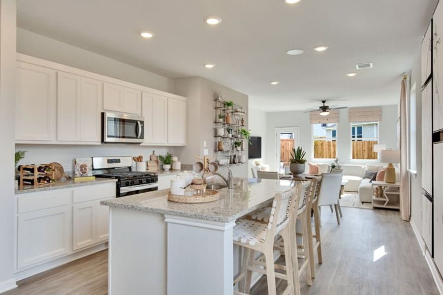 A kitchen with white cabinets. A kitchen with white cabinets.