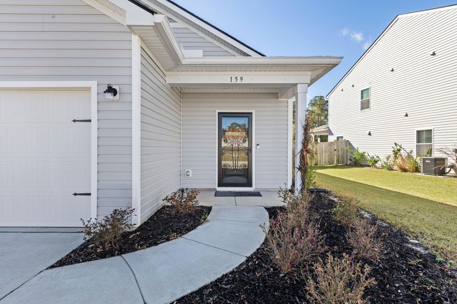 Exterior details and patio area of a home in K. Hovnanian's® Four Seasons at Lakes of Cane Bay, Summerville (Image 22). Exterior details and patio area of a home in K. Hovnanian's® Four Seasons at Lakes of Cane Bay, Summerville (Image 22).