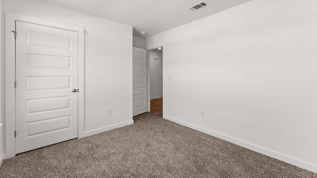 Spacious, unfurnished interior of a new home in Magnolia at the Bluffs Phase 3, Freeport (Image 20).