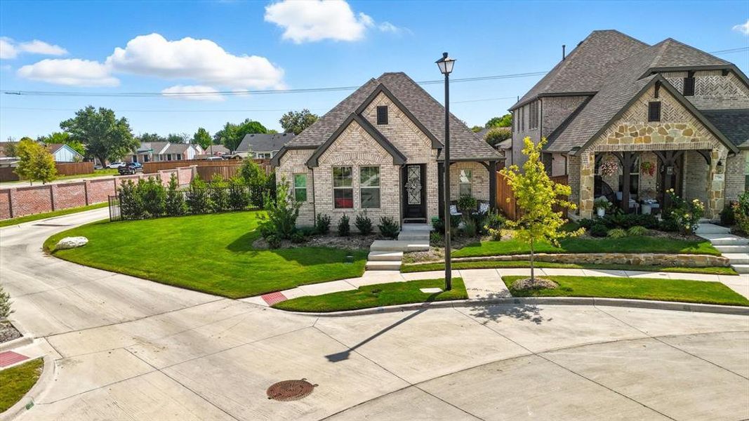 View of front of house featuring stone siding and brick siding