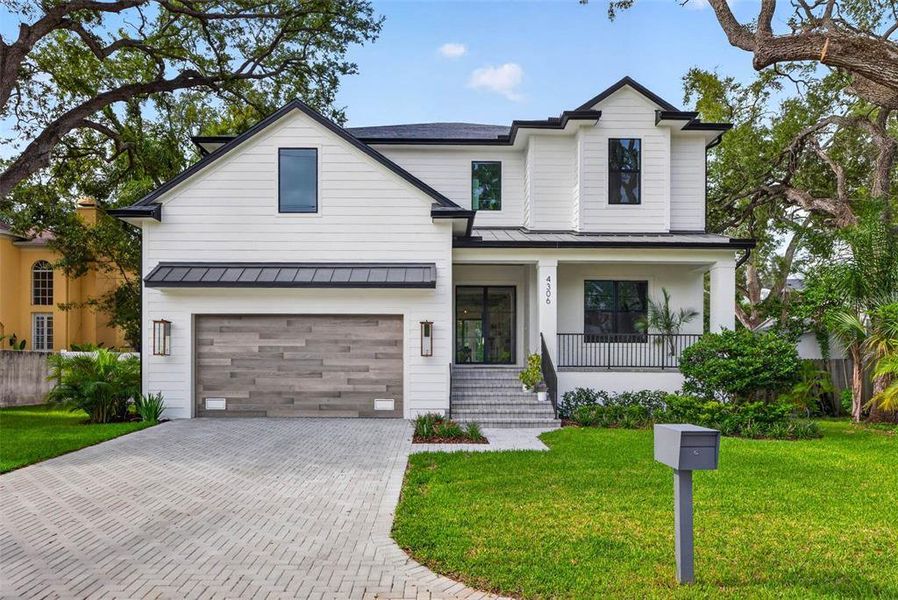 Front exterior of a new home in , Tampa, FL, highlighting curb appeal (Image 1). Front exterior of a new home in , Tampa, FL, highlighting curb appeal (Image 1).
