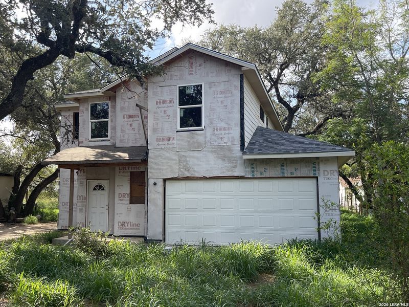 Front exterior of a new home in , Poteet, TX, highlighting curb appeal (Image 1). Front exterior of a new home in , Poteet, TX, highlighting curb appeal (Image 1).