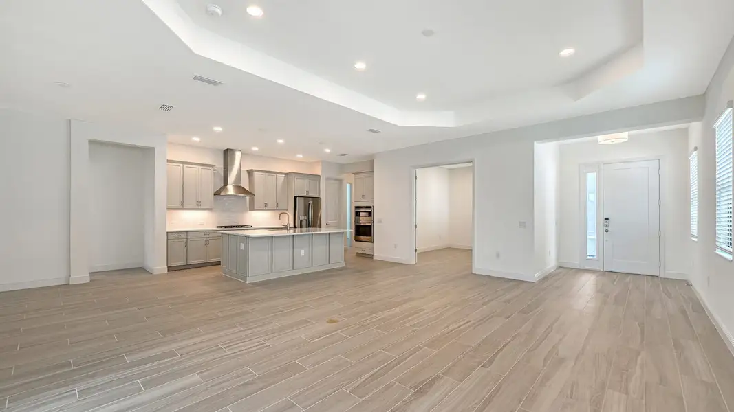 Spacious, unfurnished interior of a new home in Palm Grove Real Estate and Homes for Sale in Lakewood Ranch, FL - Neal Communities, Bradenton (Image 14).