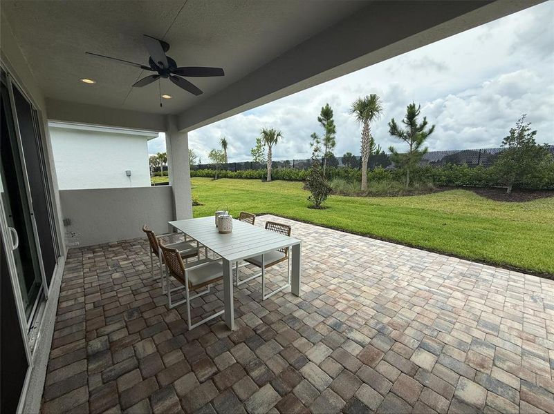 Exterior details and patio area of a home in Valencia Ridge (55+), Wesley Chapel (Image 4).