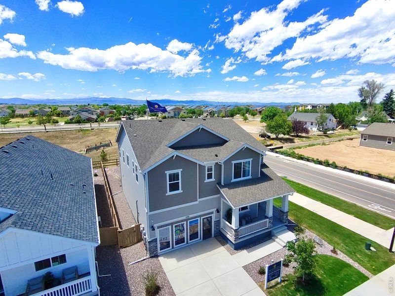 Front exterior of a new home in Trevenna, Windsor, CO, highlighting curb appeal (Image 23).