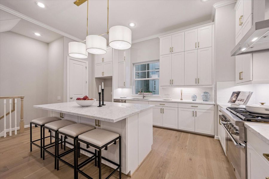 Kitchen and island areas with open-concept design.