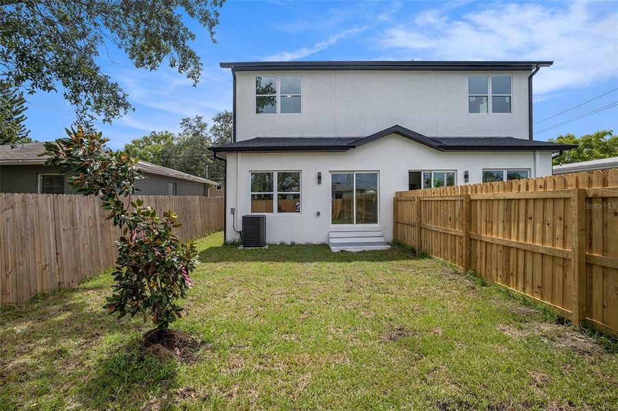Front exterior of a new home in , Tampa, FL, highlighting curb appeal (Image 22).